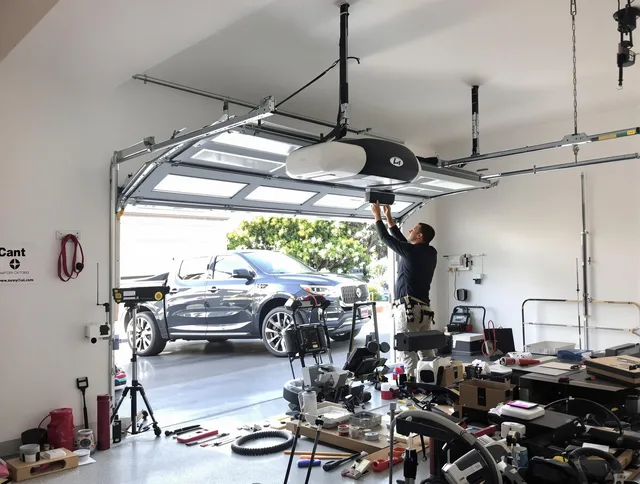 New Albany Garage Door Repair specialist installing smart garage door opener system in New Albany home