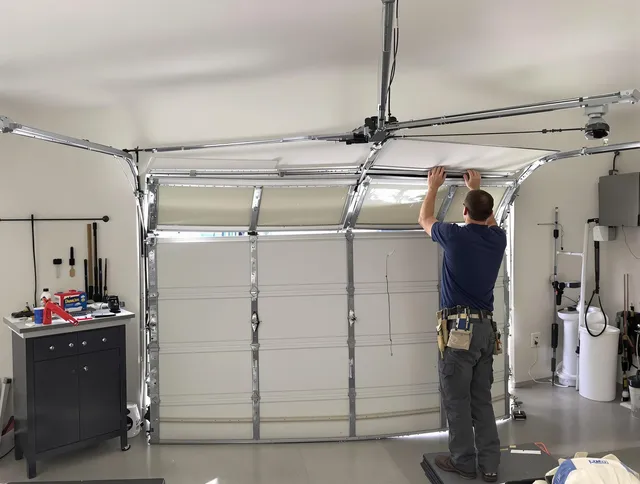 New Albany Garage Door Repair specialist performing precise section replacement on New Albany garage door